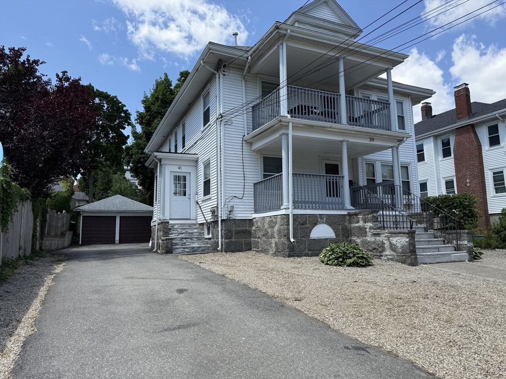 41 Woodward Avenue, Unit 2 Quincy, MA 02169 - Photo 23 of 27 a view of a house with a yard and tree
