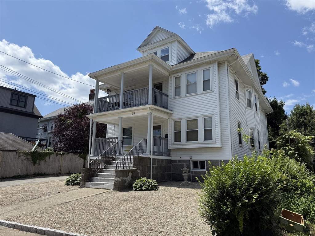 41 Woodward Avenue, Unit 2 Quincy, MA 02169 - Photo 24 of 27 a front view of a house with garden