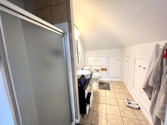 a view of a living room with a fireplace