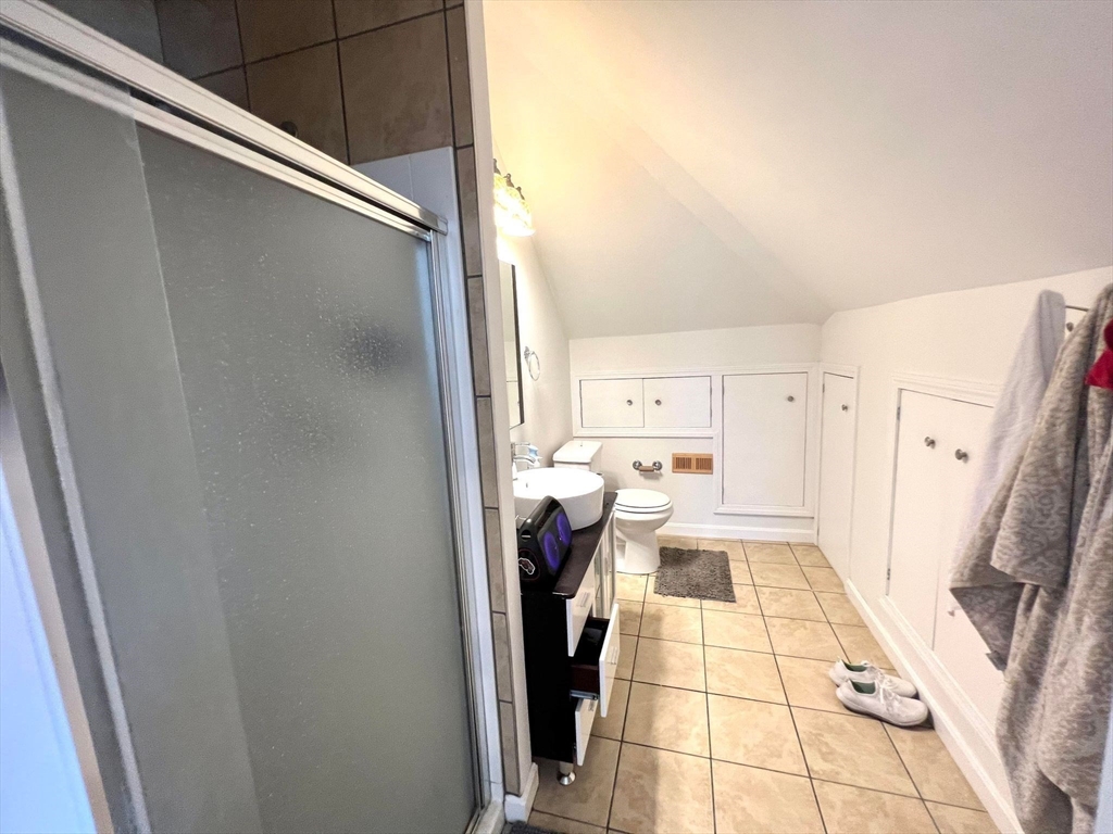 41 Woodward Avenue, Unit 2 Quincy, MA 02169 - Photo 6 of 27 a view of a living room with a fireplace