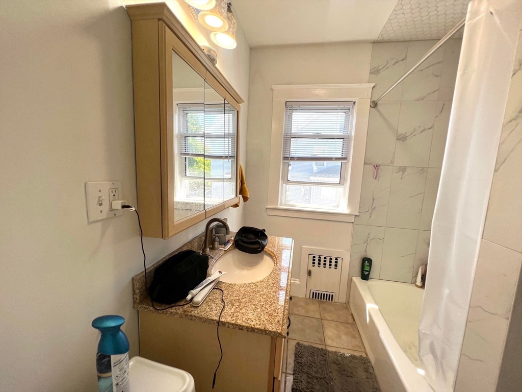 41 Woodward Avenue, Unit 2 Quincy, MA 02169 - Photo 7 of 27 a bath room with a sink and a toilet