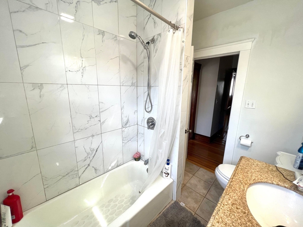 41 Woodward Avenue, Unit 2 Quincy, MA 02169 - Photo 8 of 27 a bathroom with a tub and shower
