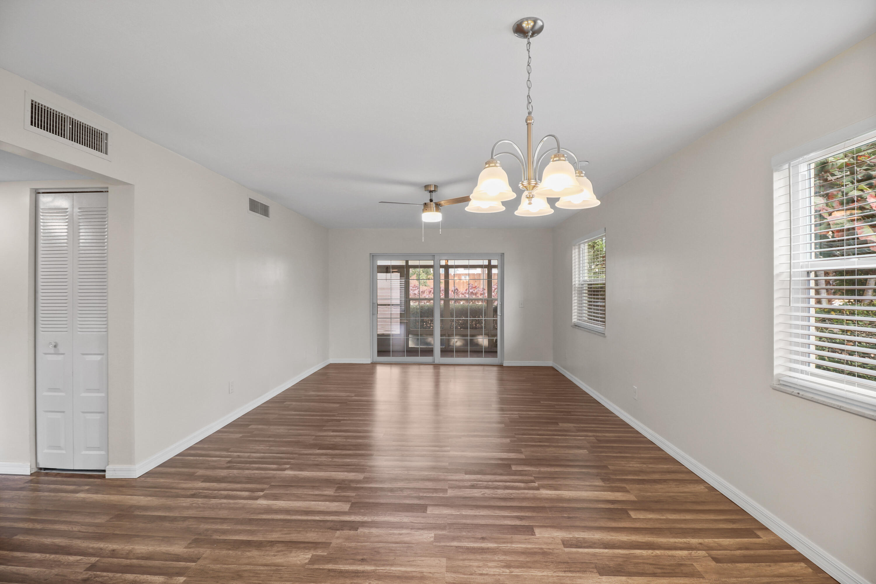 2950 Southeast Ocean Boulevard, Unit 1304 Stuart, FL 34996 - Photo 16 of 35 a view of an empty room with wooden floor and a window