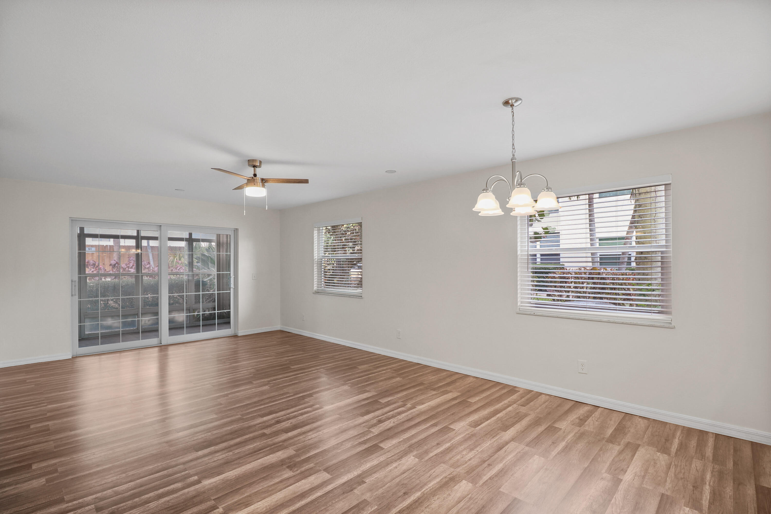 2950 Southeast Ocean Boulevard, Unit 1304 Stuart, FL 34996 - Photo 17 of 35 a view of an empty room with wooden floor and a window