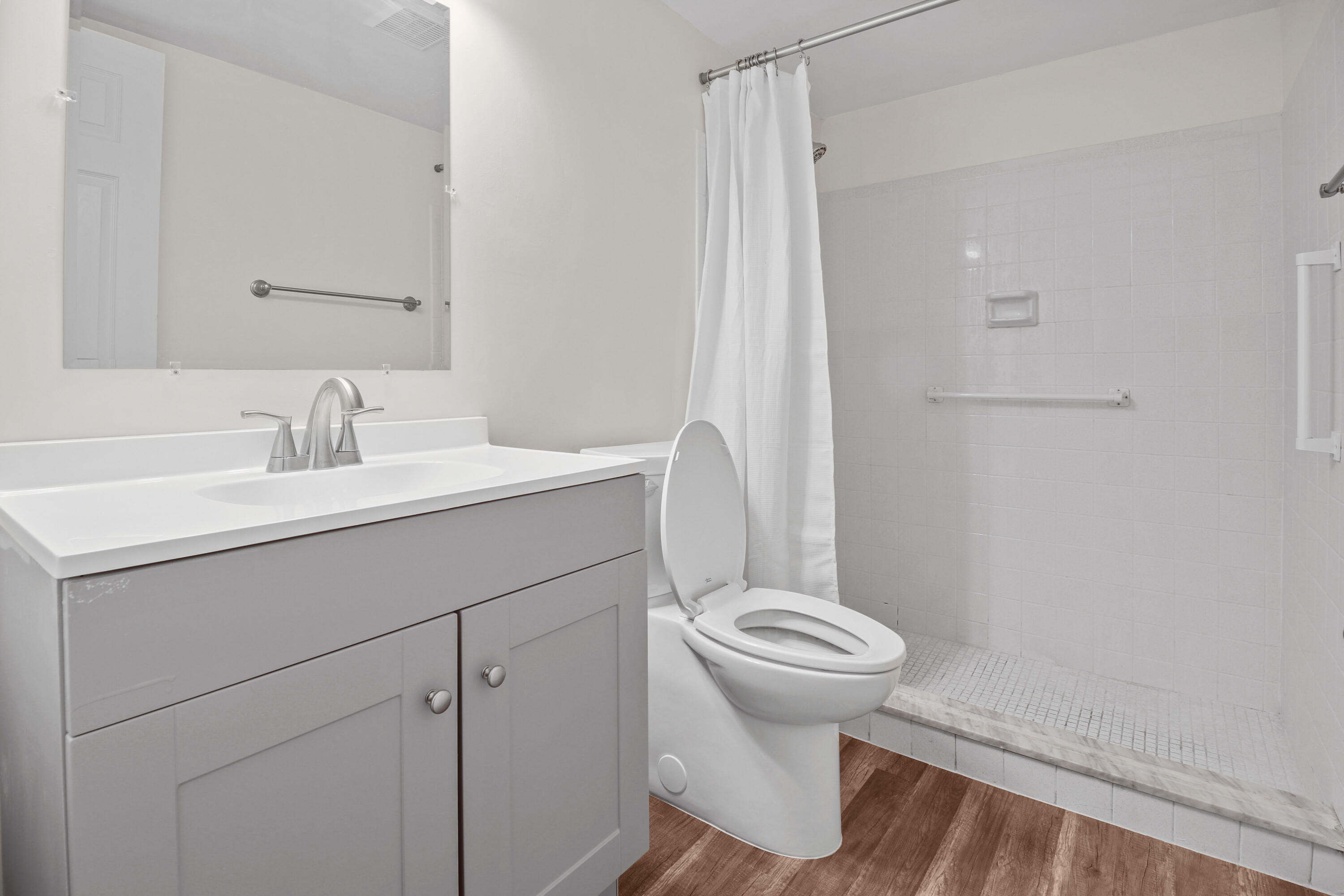 2950 Southeast Ocean Boulevard, Unit 1304 Stuart, FL 34996 - Photo 25 of 35 a bathroom with a sink toilet and shower
