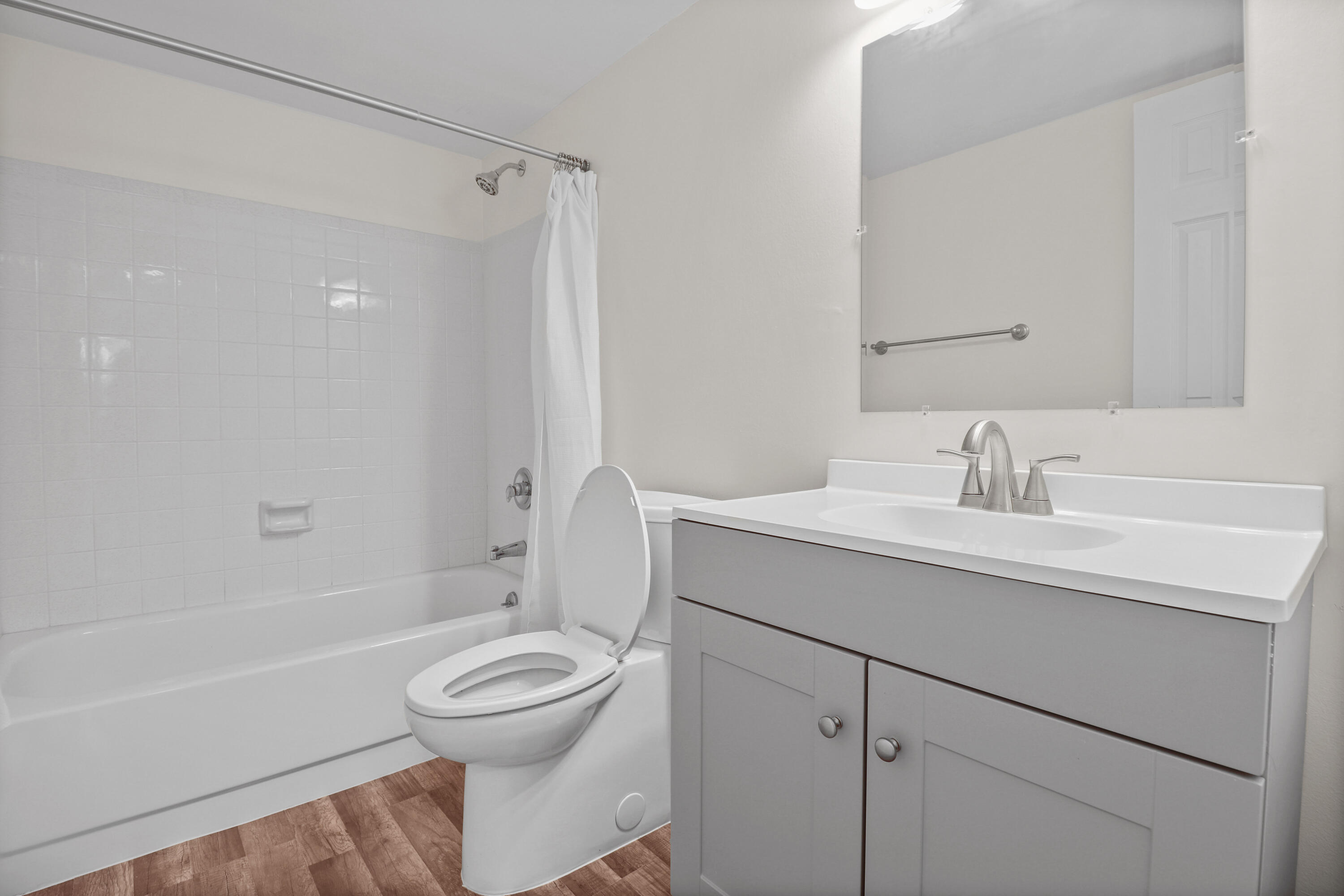 2950 Southeast Ocean Boulevard, Unit 1304 Stuart, FL 34996 - Photo 26 of 35 a bathroom with a sink toilet a mirror and shower