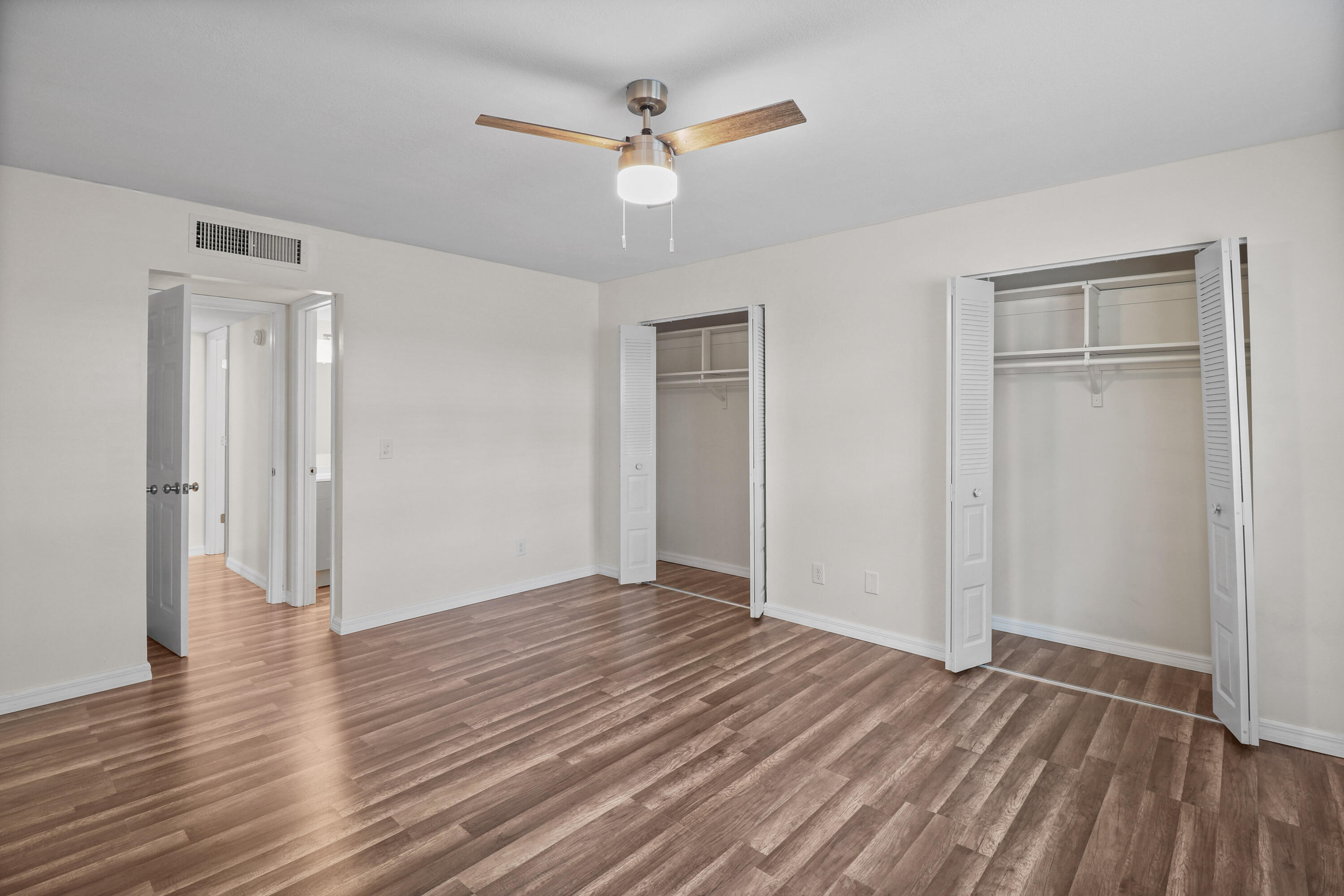 2950 Southeast Ocean Boulevard, Unit 1304 Stuart, FL 34996 - Photo 27 of 35 a view of an empty room with wooden floor