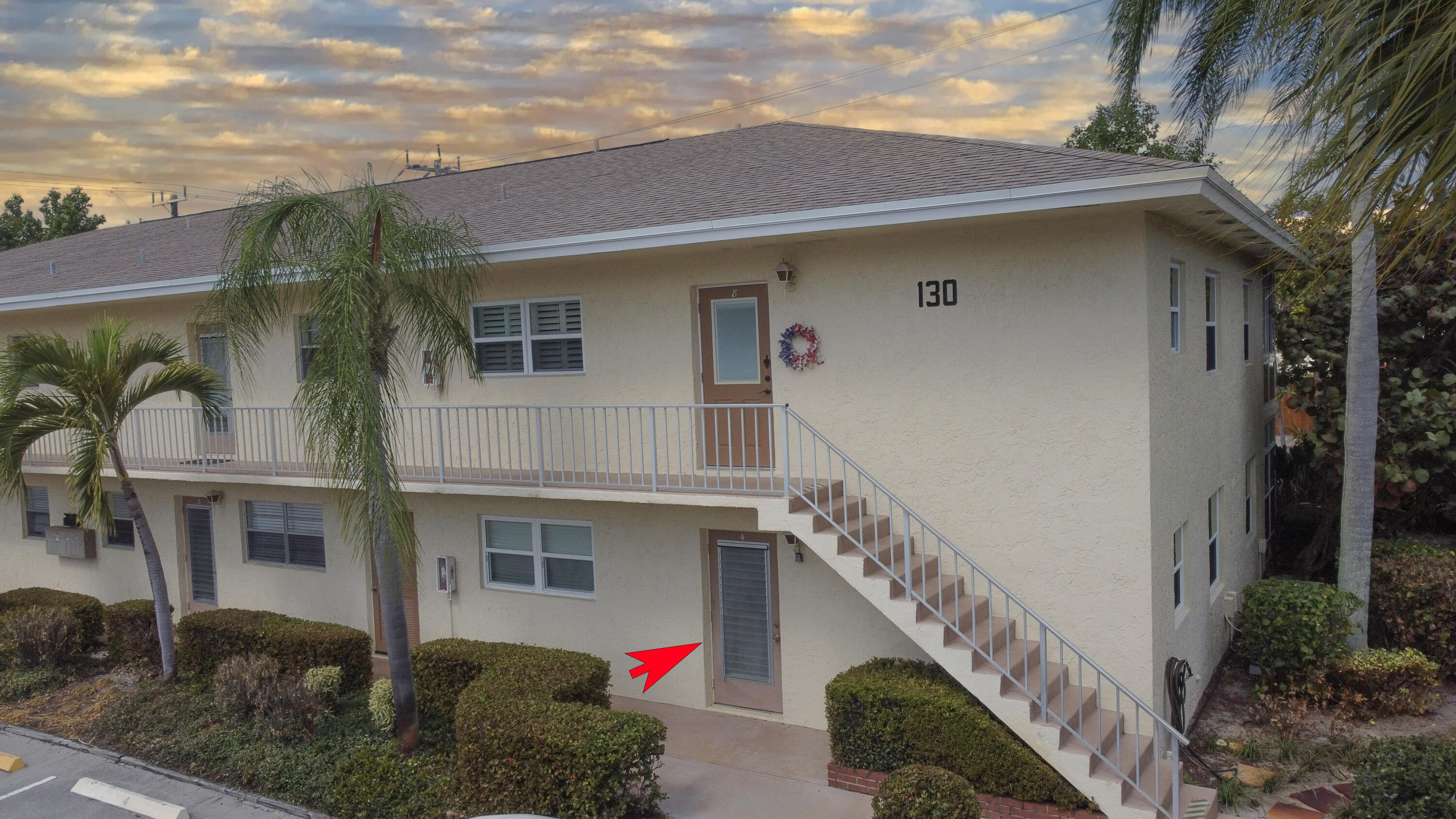 2950 Southeast Ocean Boulevard, Unit 1304 Stuart, FL 34996 - Photo 3 of 35 a front view of a house with stairs