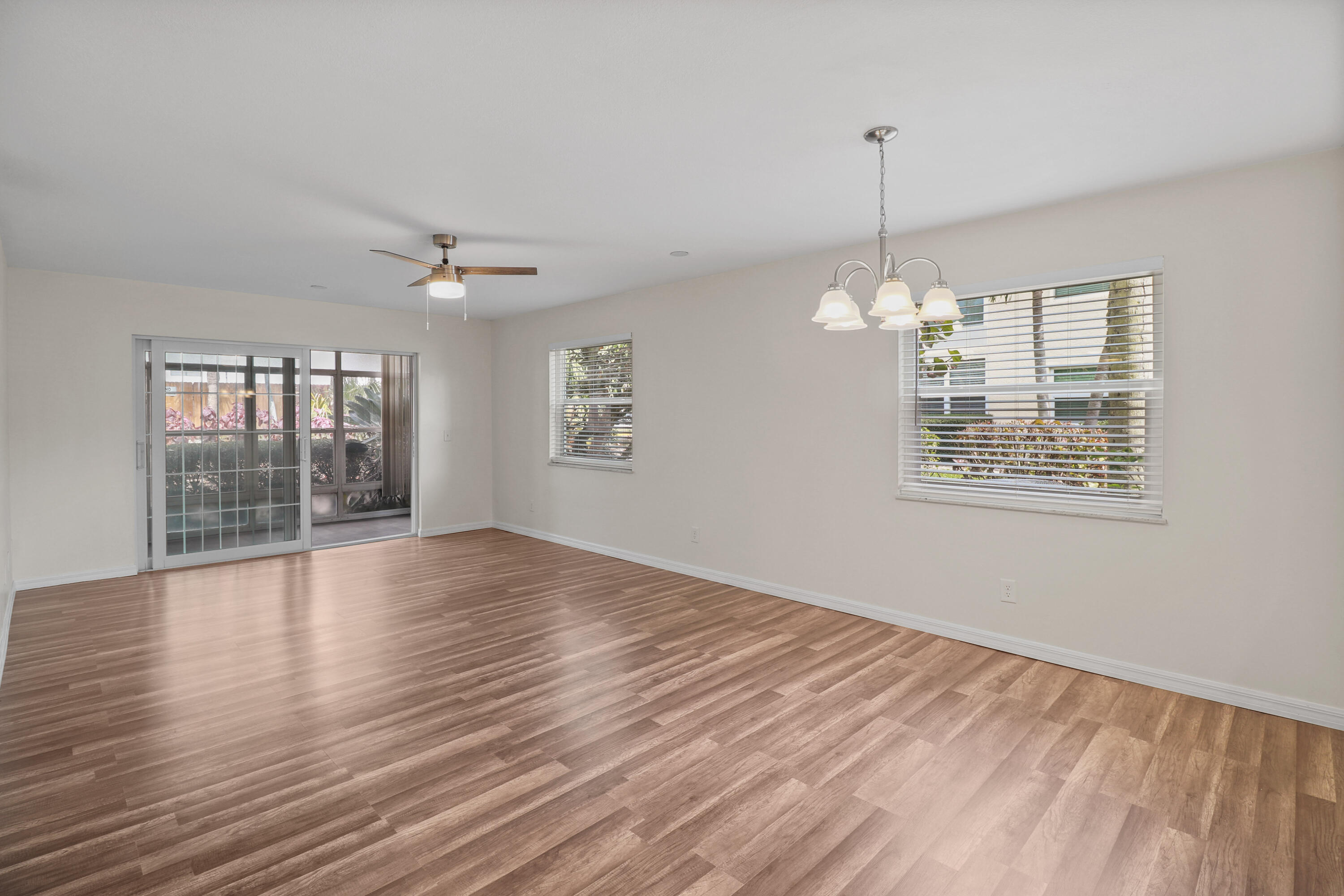 2950 Southeast Ocean Boulevard, Unit 1304 Stuart, FL 34996 - Photo 33 of 35 a view of an empty room with wooden floor and a window