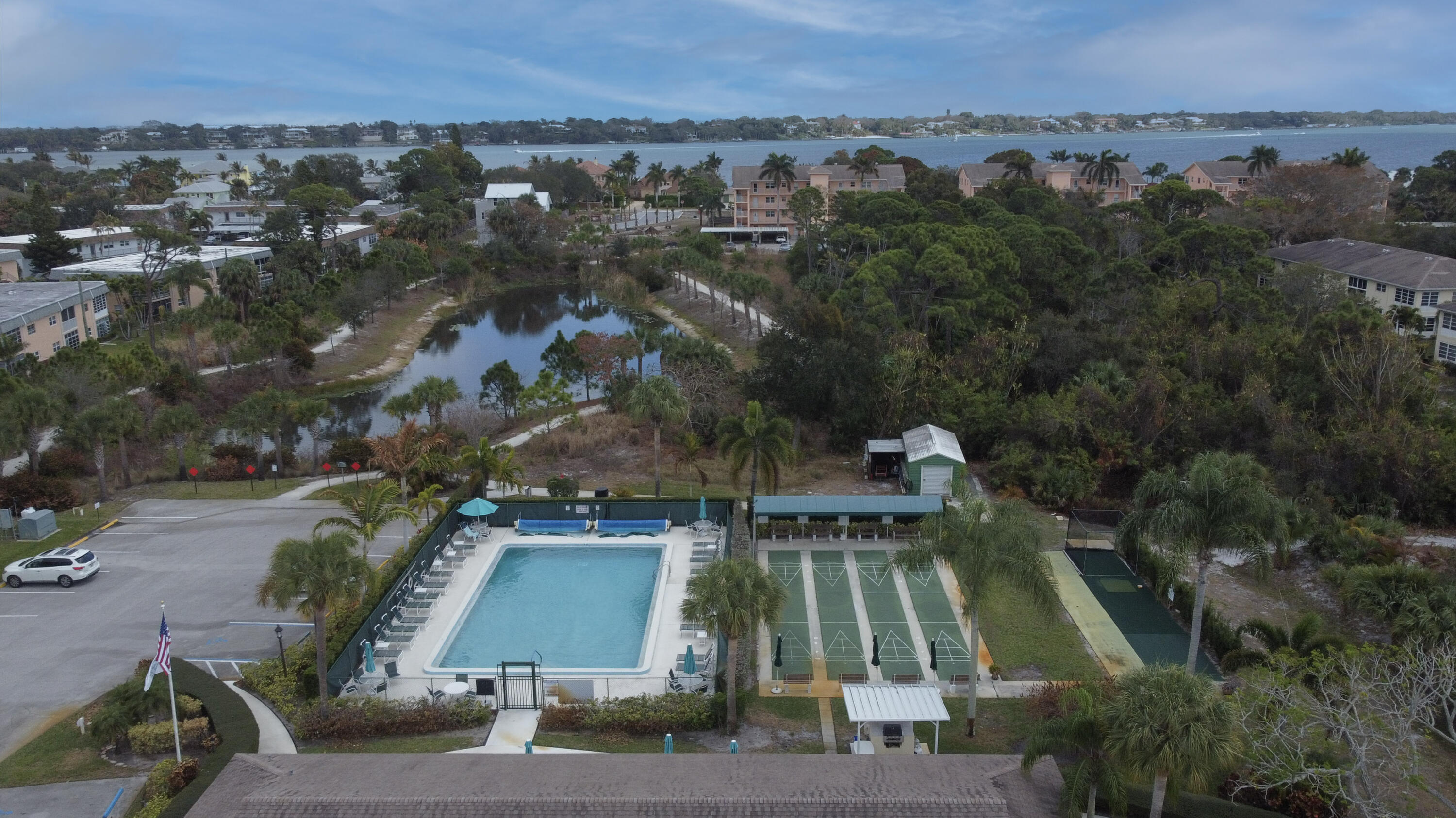 2950 Southeast Ocean Boulevard, Unit 1304 Stuart, FL 34996 - Photo 8 of 35 an aerial view of a houses with a yard
