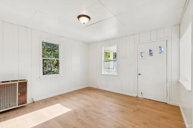 a view of a kitchen with a refrigerator a stove top oven and a refrigerator