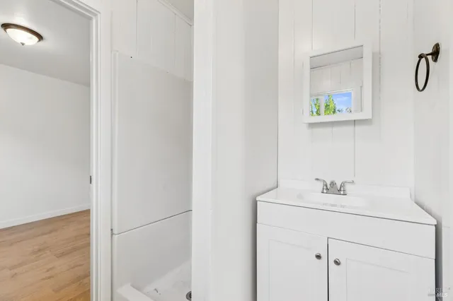 a bathroom with a toilet and a shower curtain