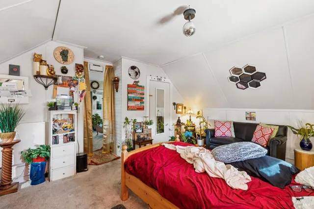 a bed room with a bed and a chandelier