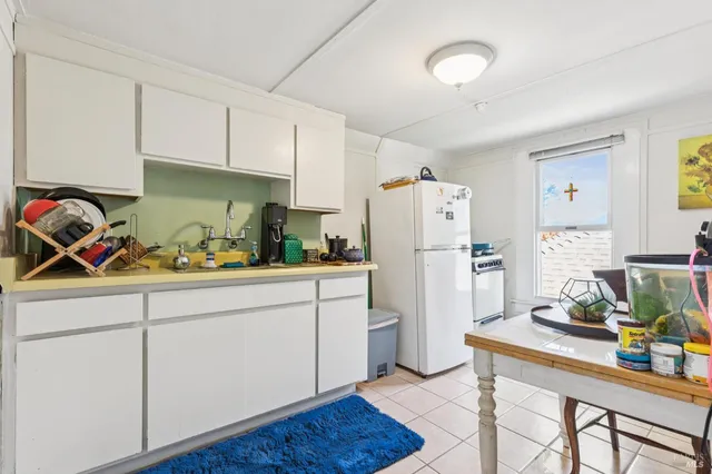 a bedroom with a bed and a table in it