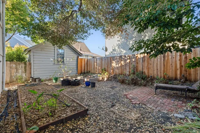 a bathroom with a granite countertop sink and a window