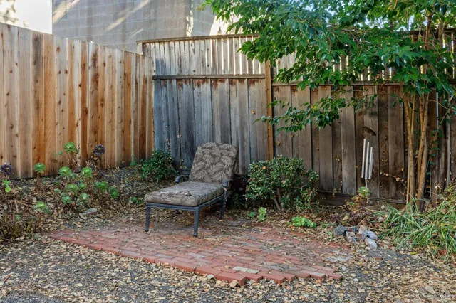 a view of a hallway with entryway wooden floor and front door