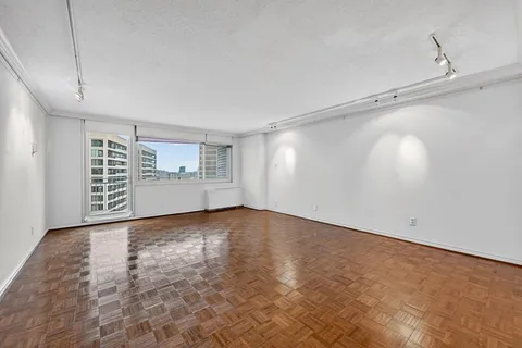 a view of an empty room with a window