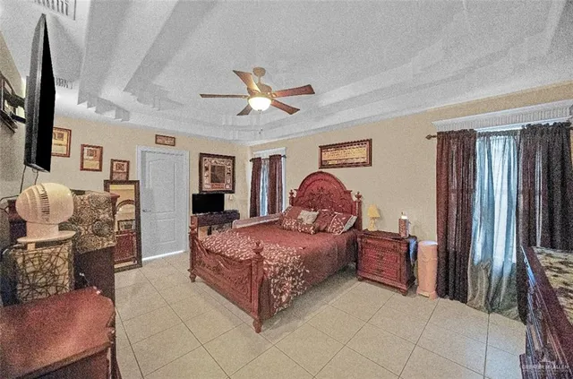 a bedroom with a bed a couch and dresser