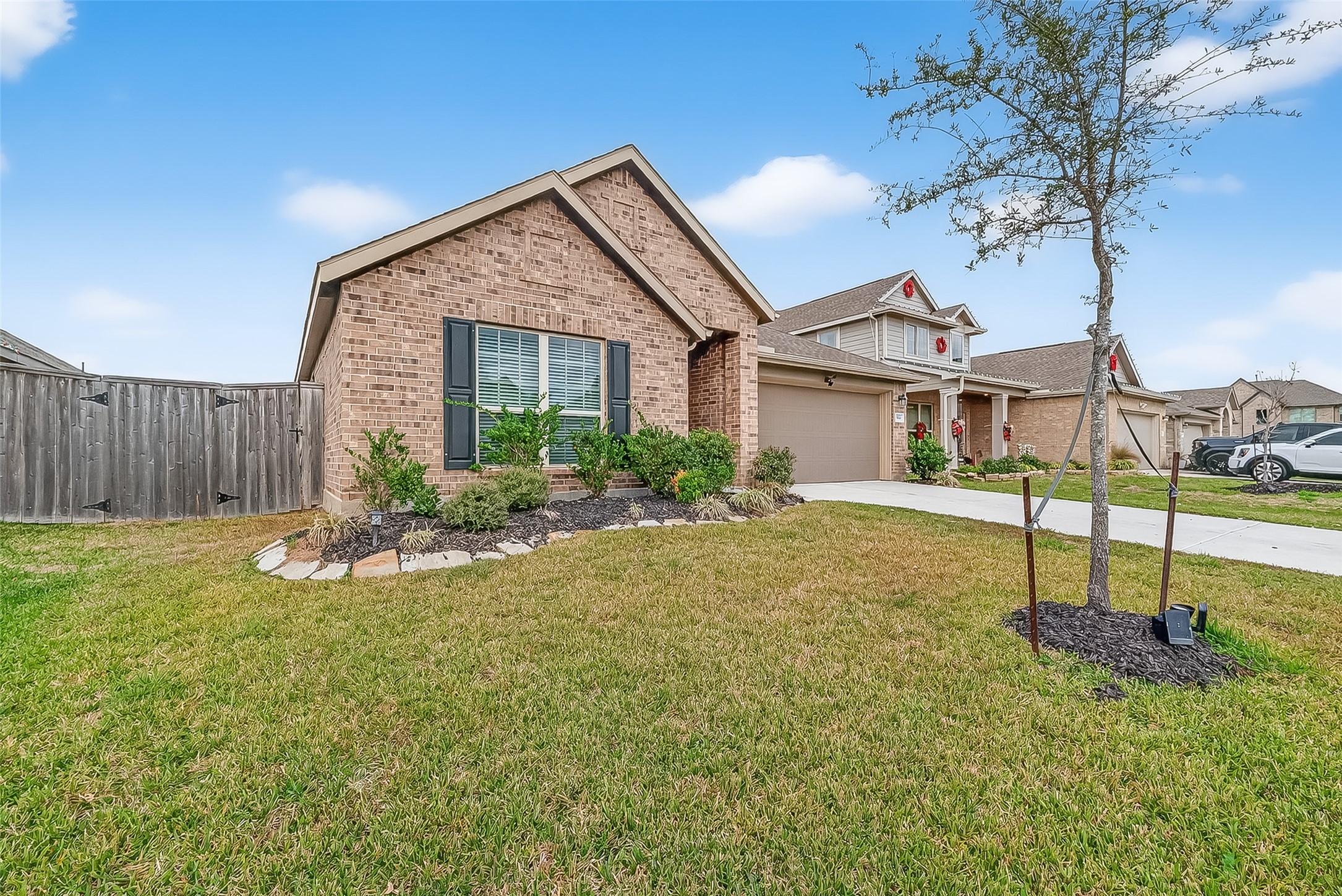 19168 Pinewood Grove Trail New Caney, TX 77357 - Photo 2 of 41 a view of a house with backyard and tree