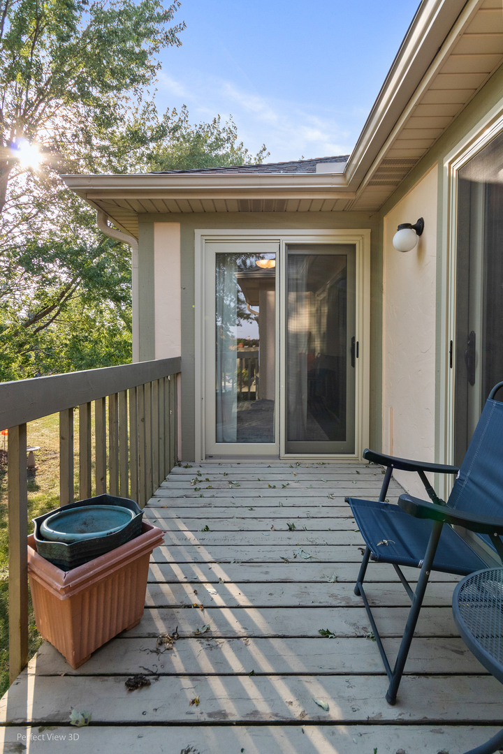 802 Meadow Ridge Lane, Unit 104 New Lenox, IL 60451 - Photo 12 of 15 a view of house with outdoor seating space