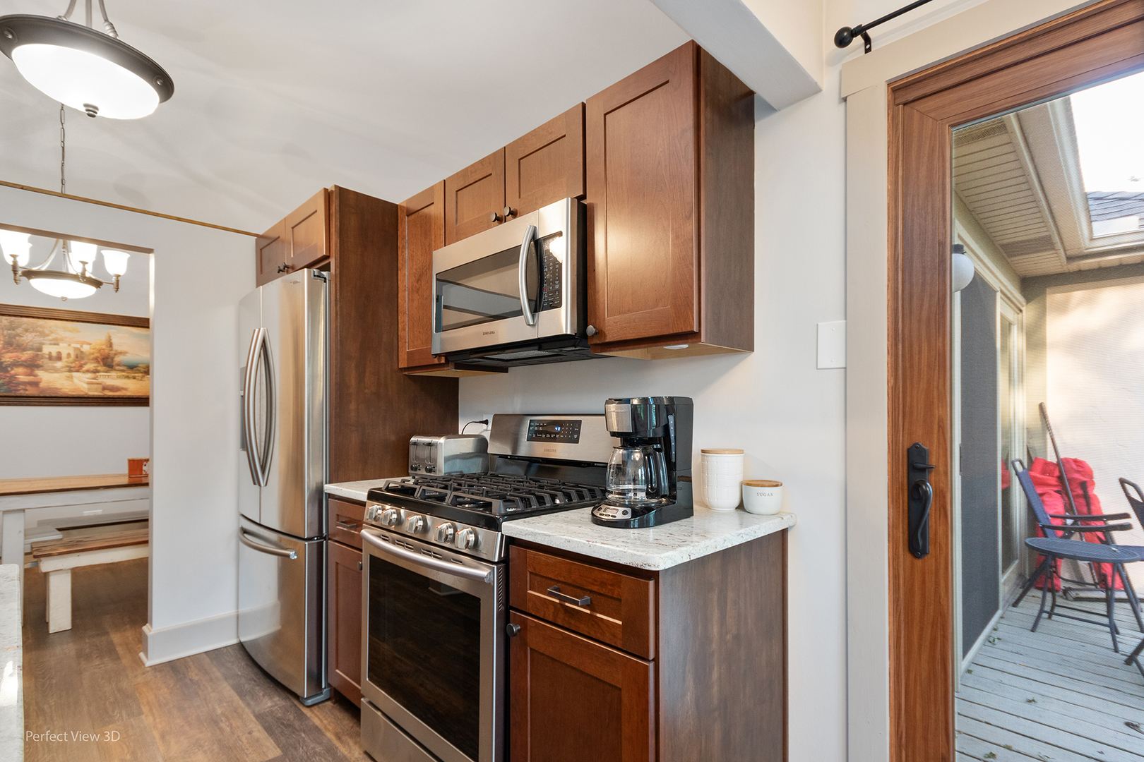 802 Meadow Ridge Lane, Unit 104 New Lenox, IL 60451 - Photo 8 of 15 a kitchen with stainless steel appliances granite countertop a refrigerator stove and sink