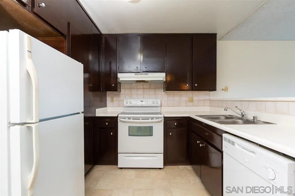6780 Friars Road, Unit 257 San Diego, CA 92108 - Photo 5 of 20 a kitchen with a sink and a refrigerator