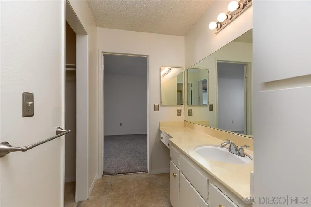 6780 Friars Road, Unit 257 San Diego, CA 92108 - Photo 10 of 20 a bathroom with a tub sink and mirror