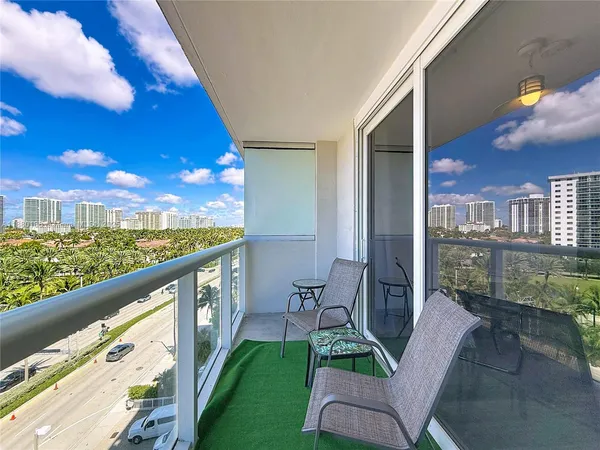 a view of balcony with furniture