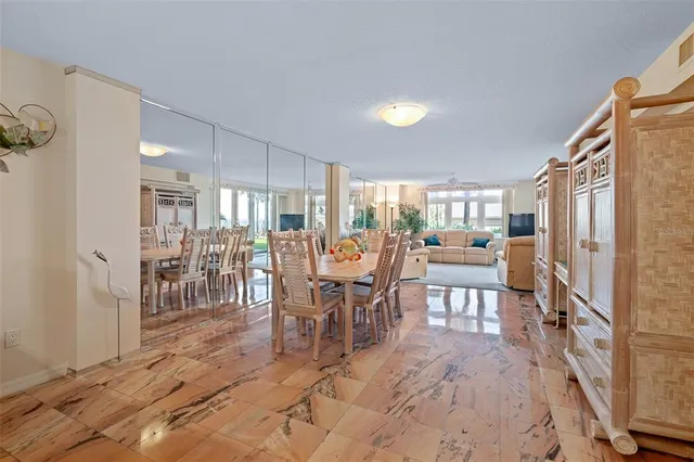 a dining room with furniture and window