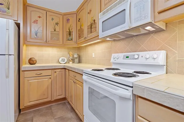 a bedroom with two beds and painting on the wall