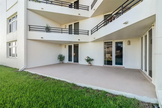 a view of a house with a porch and potted plants