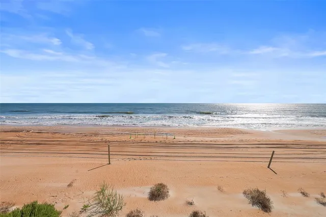 a view of a swimming pool with a lounge chairs