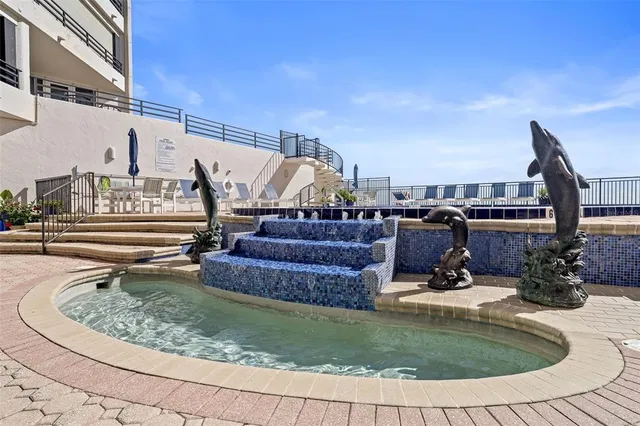 a view of a swimming pool with chairs
