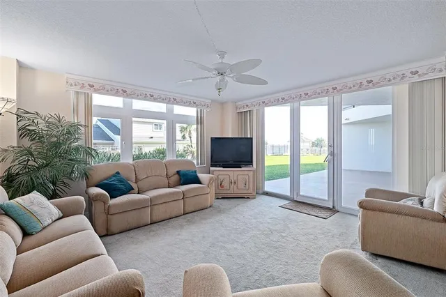 a view of a hallway with wooden floor and a glass door