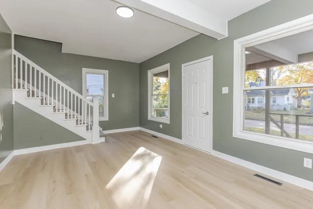 a view of entryway with wooden floor