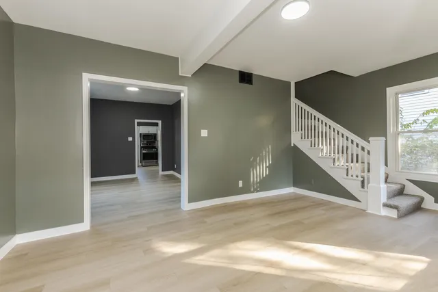 a view of an empty room and window