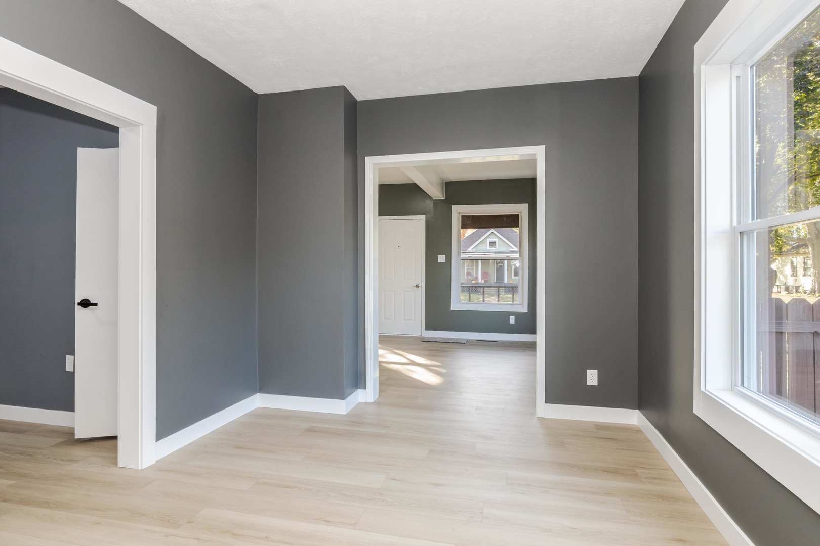 417 East Timber Street Pontiac, IL 61764 - Photo 17 of 43 a view of an empty room with wooden floor and a window