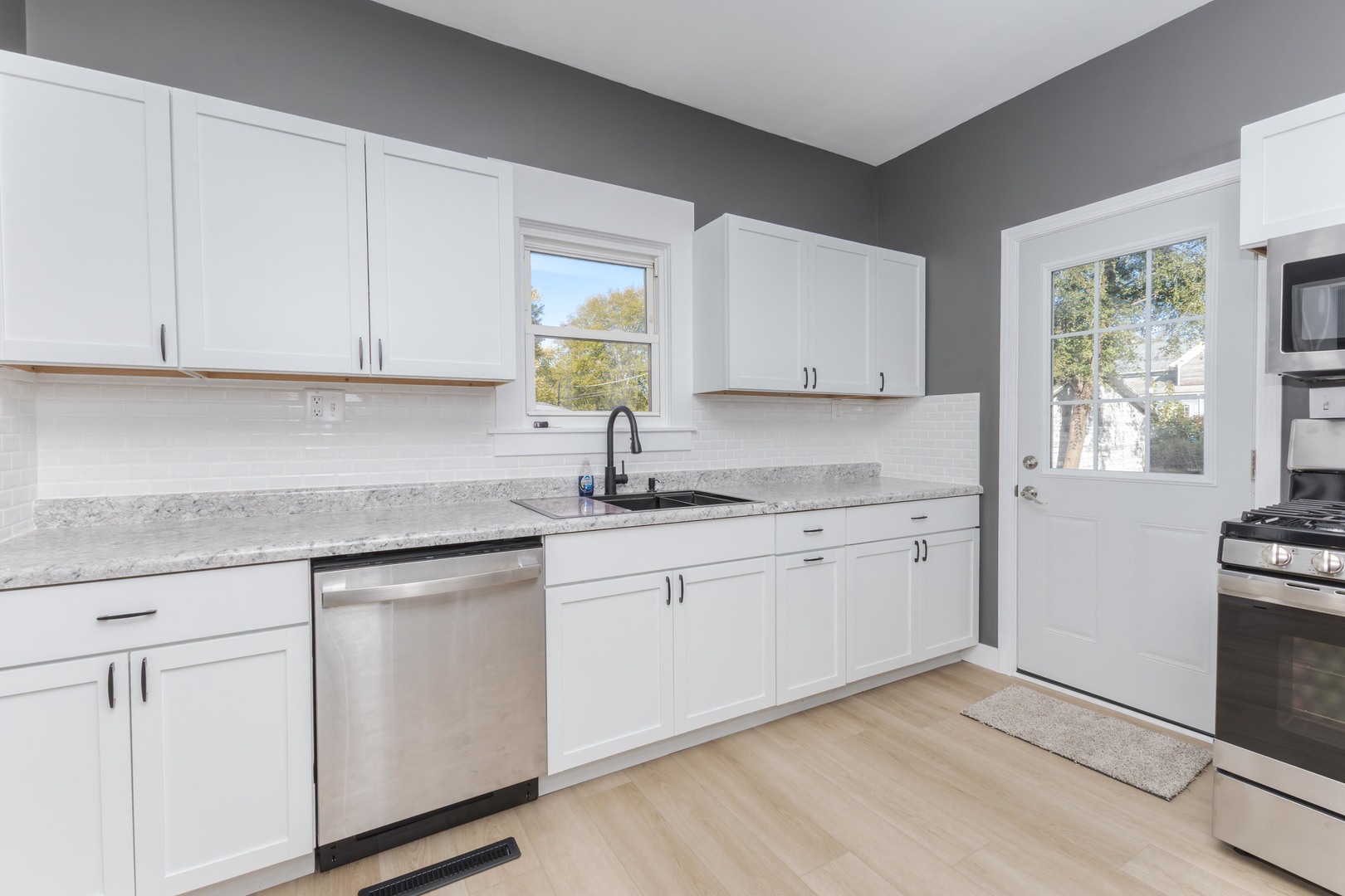 417 East Timber Street Pontiac, IL 61764 - Photo 20 of 43 a kitchen with granite countertop white cabinets white appliances and a sink