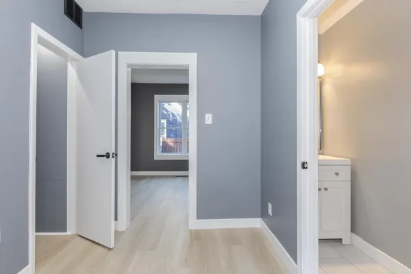 a view of an empty room with a window