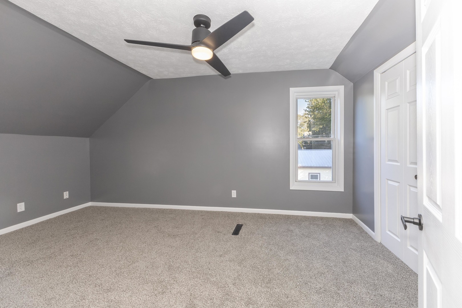 417 East Timber Street Pontiac, IL 61764 - Photo 32 of 43 an empty room with windows and fan