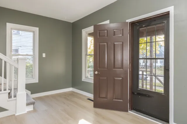 a view of an empty room with a window