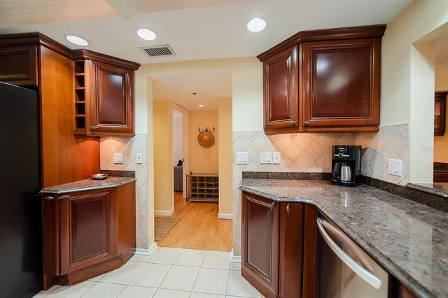 a view of a city from a balcony with furniture