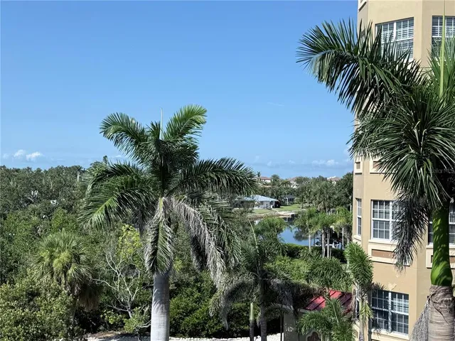 a view of a hallway with a wooden cabinets