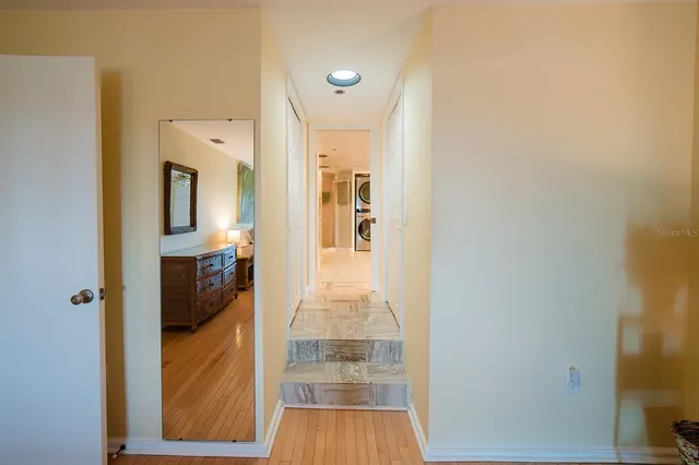 a bathroom with a granite countertop sink and a large mirror