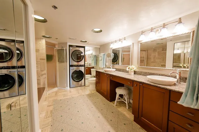 a bathroom with a shower and a sink