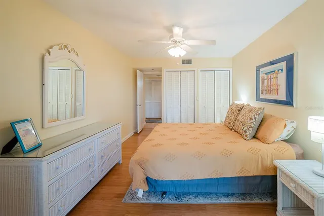 a bedroom with a bed and dresser