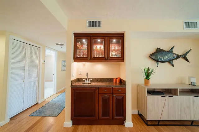 a kitchen with stainless steel appliances granite countertop a sink and cabinets