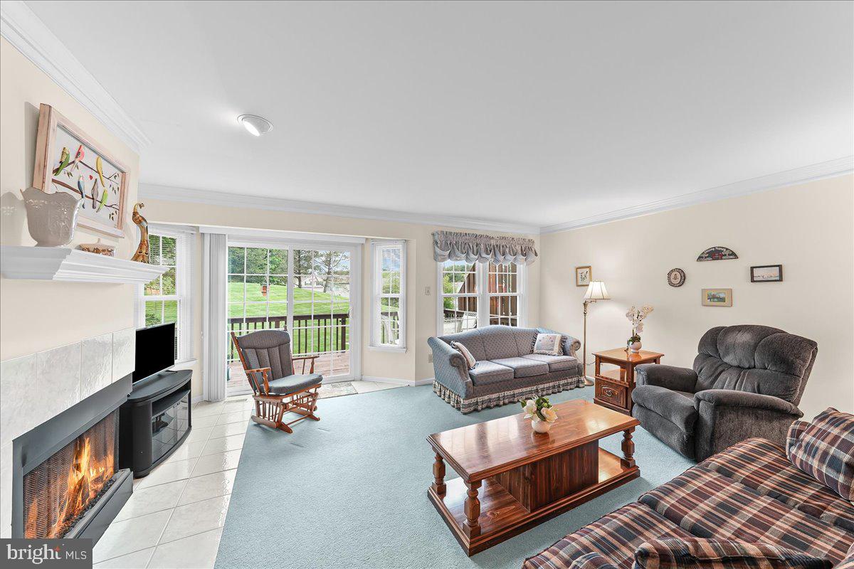 402 Sumner Way West Chester, PA 19382 - Photo 7 of 33 Family room with lots of windows & door to deck