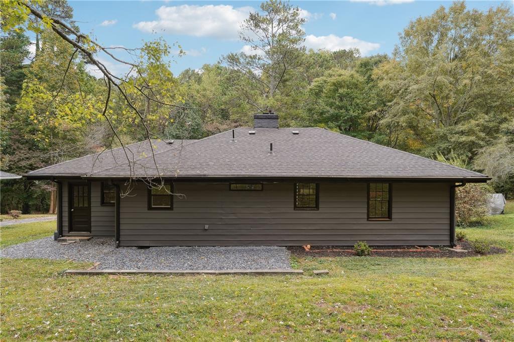 3644 Lakeside Court Tucker, GA 30084 - Photo 11 of 12 a front view of a house with a garden
