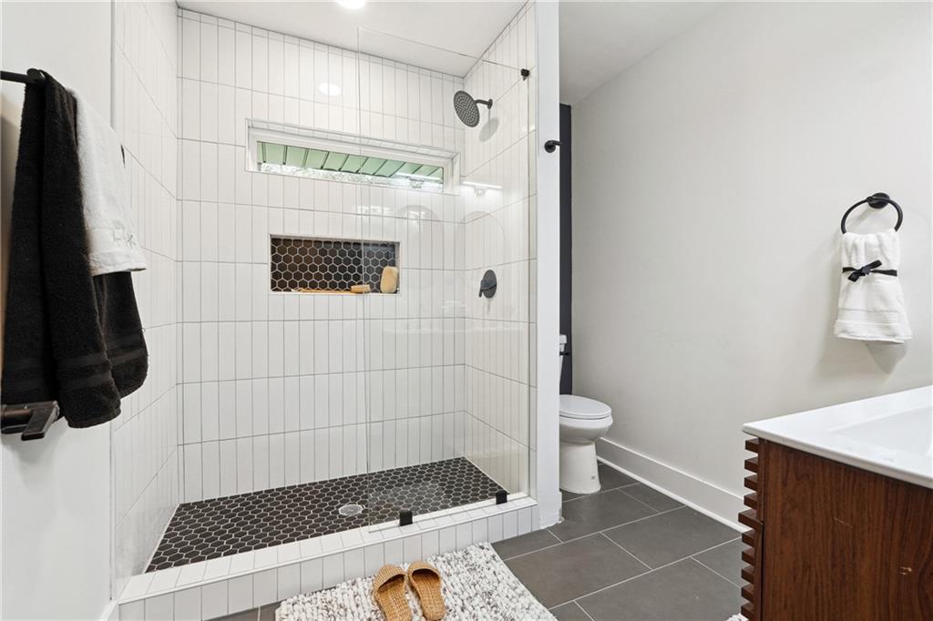 3644 Lakeside Court Tucker, GA 30084 - Photo 8 of 12 a bathroom with a toilet and a shower